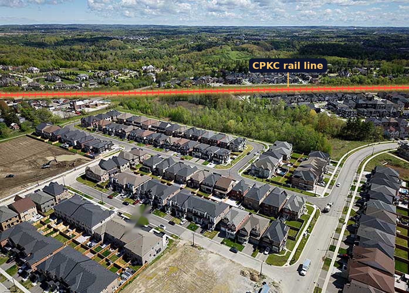 Aerial view of the new Kleinburg-Nashville neighbourhood with the CPKC rail line highlighted running across the top of the photo